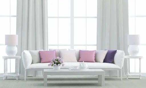 A sofa by clear windows